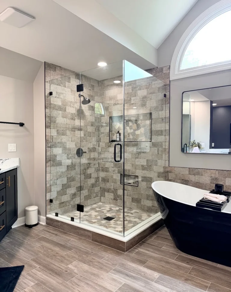 Walk-in tile shower with frameless glass enclosure