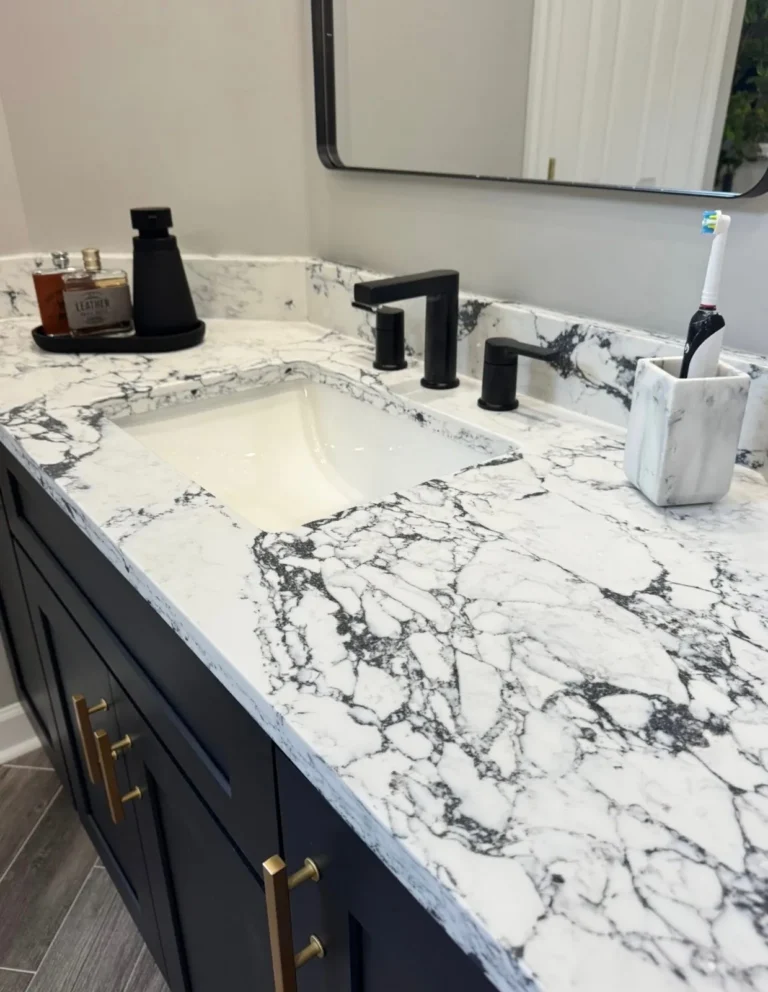 Bathroom vanity sink with stone countertop and matte black faucet