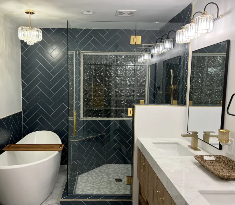 Navy herringbone bath with freestanding tub, glass-block steam shower and gold-fixture vanity, Charlotte area