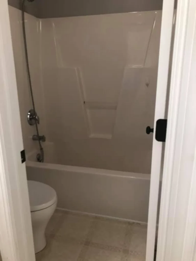 Before: dated fiberglass tub-shower combo