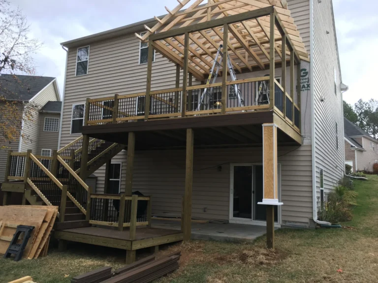 During: porch roof rafters going up on the new deck