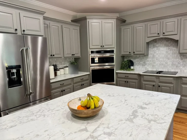 After: refrigerator and wall-oven side with gray painted cabinets