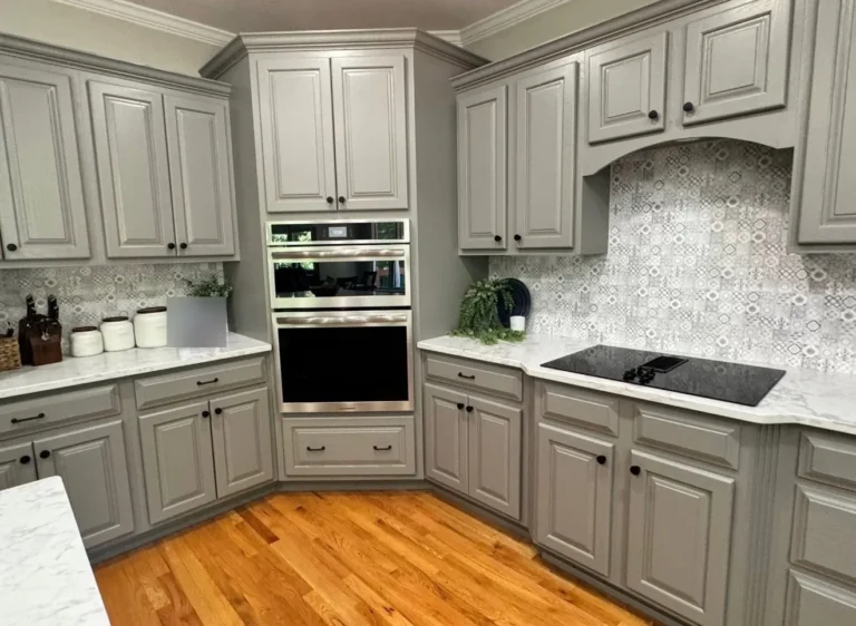 After: gray painted wall-oven cabinet and patterned tile backsplash