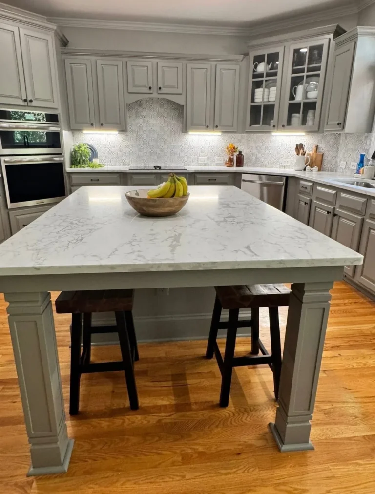 After: large quartz island with gray painted base