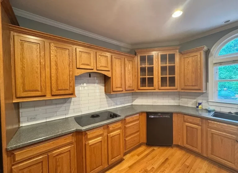 Before: oak cabinets around the cooktop and window