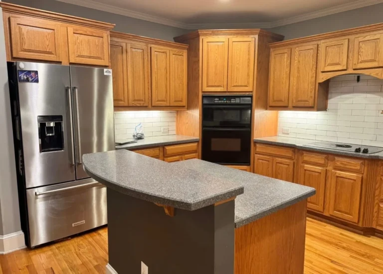 Before: oak cabinets on the refrigerator and wall-oven side