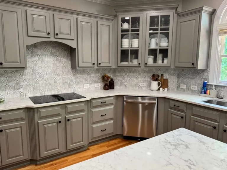 After: gray painted cabinets around the cooktop