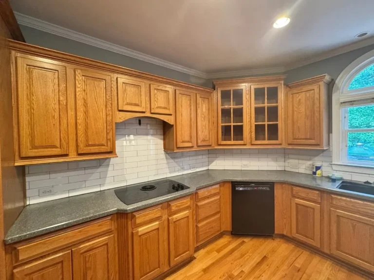 Before: oak cabinets around the cooktop