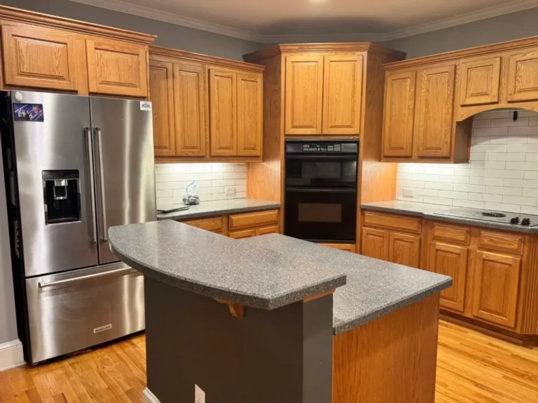 Before: oak cabinets by the refrigerator and ovens