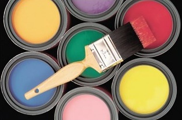 Open paint cans in many colors